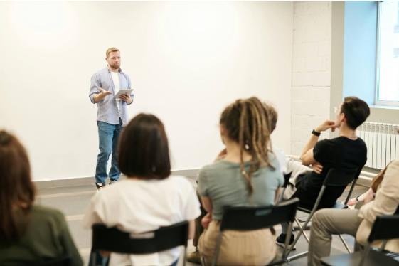 people listening to a presenter