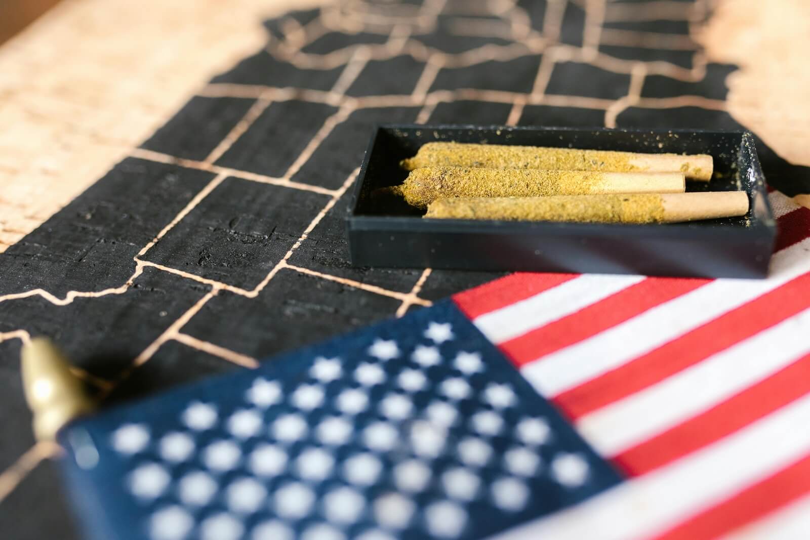 American flag - marijuana cigarette in background