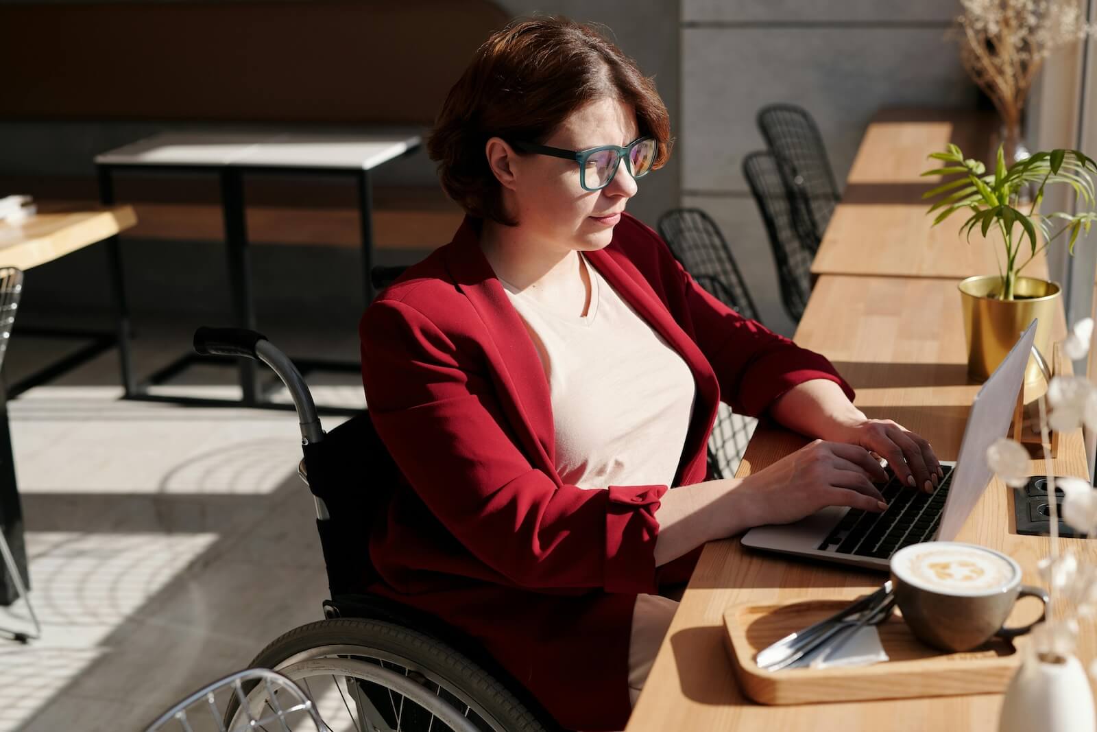 woman typing at laptop