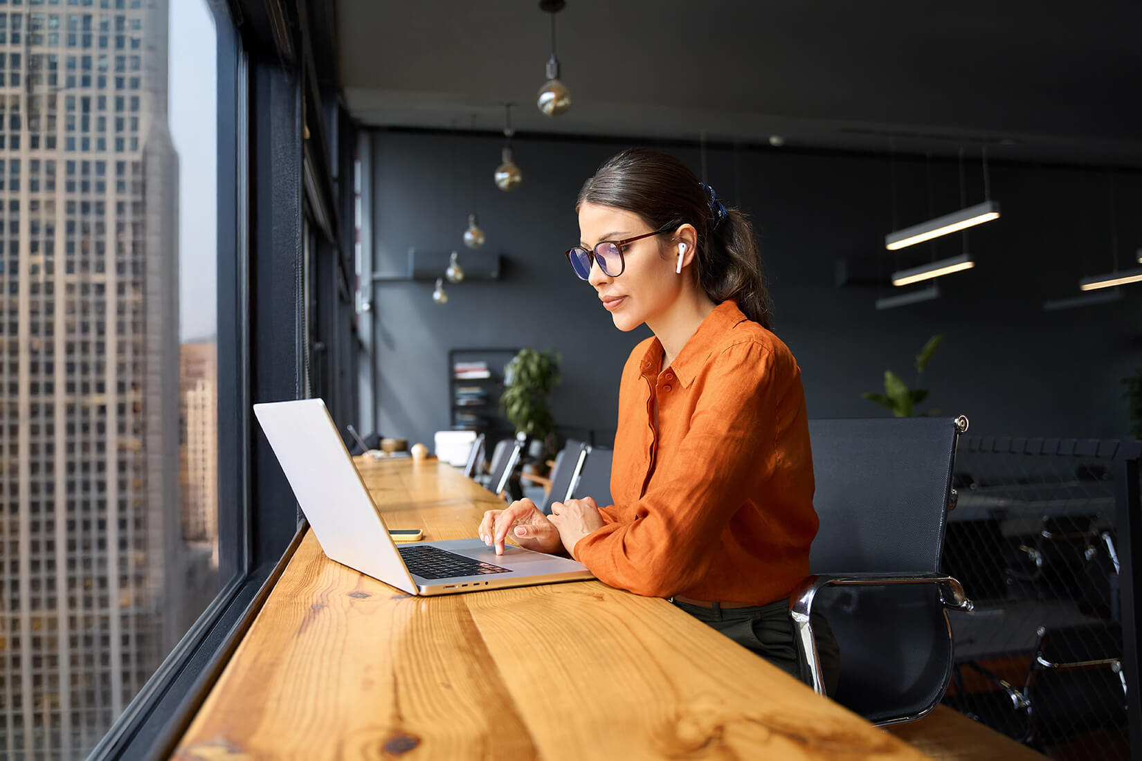 woman on laptop at a table