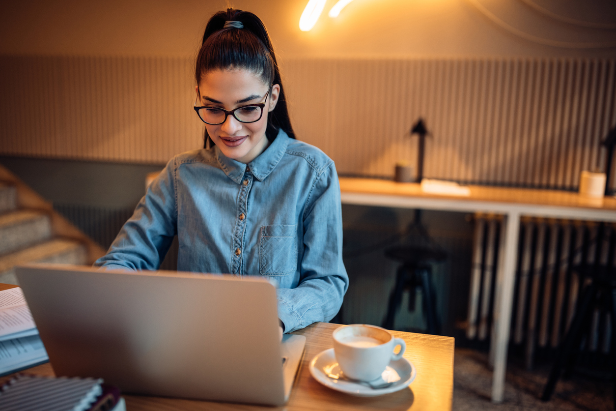 Woman on computer smiling