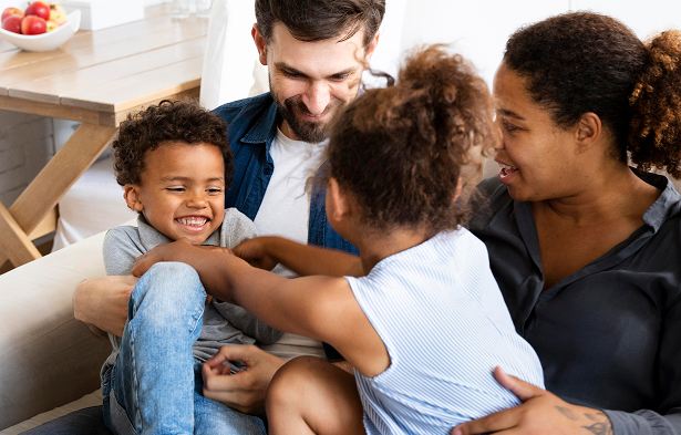 family sitting on couch